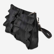 The side of a Black Lola Bow Clutch