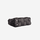 The bottom of a Black Satchel