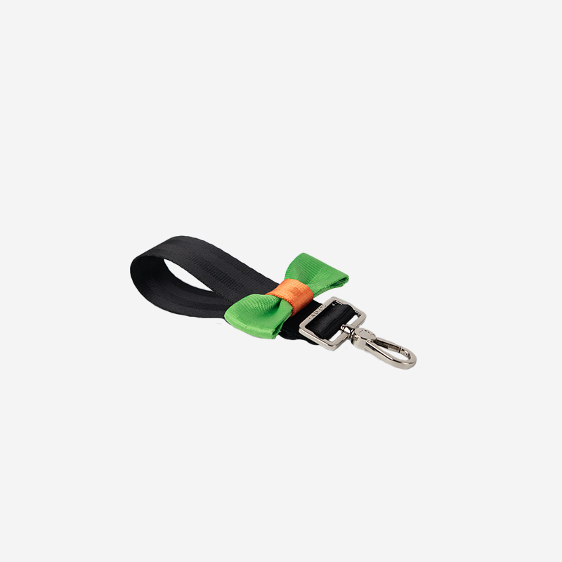 Side view of a Bow Keychain in Black and Apple