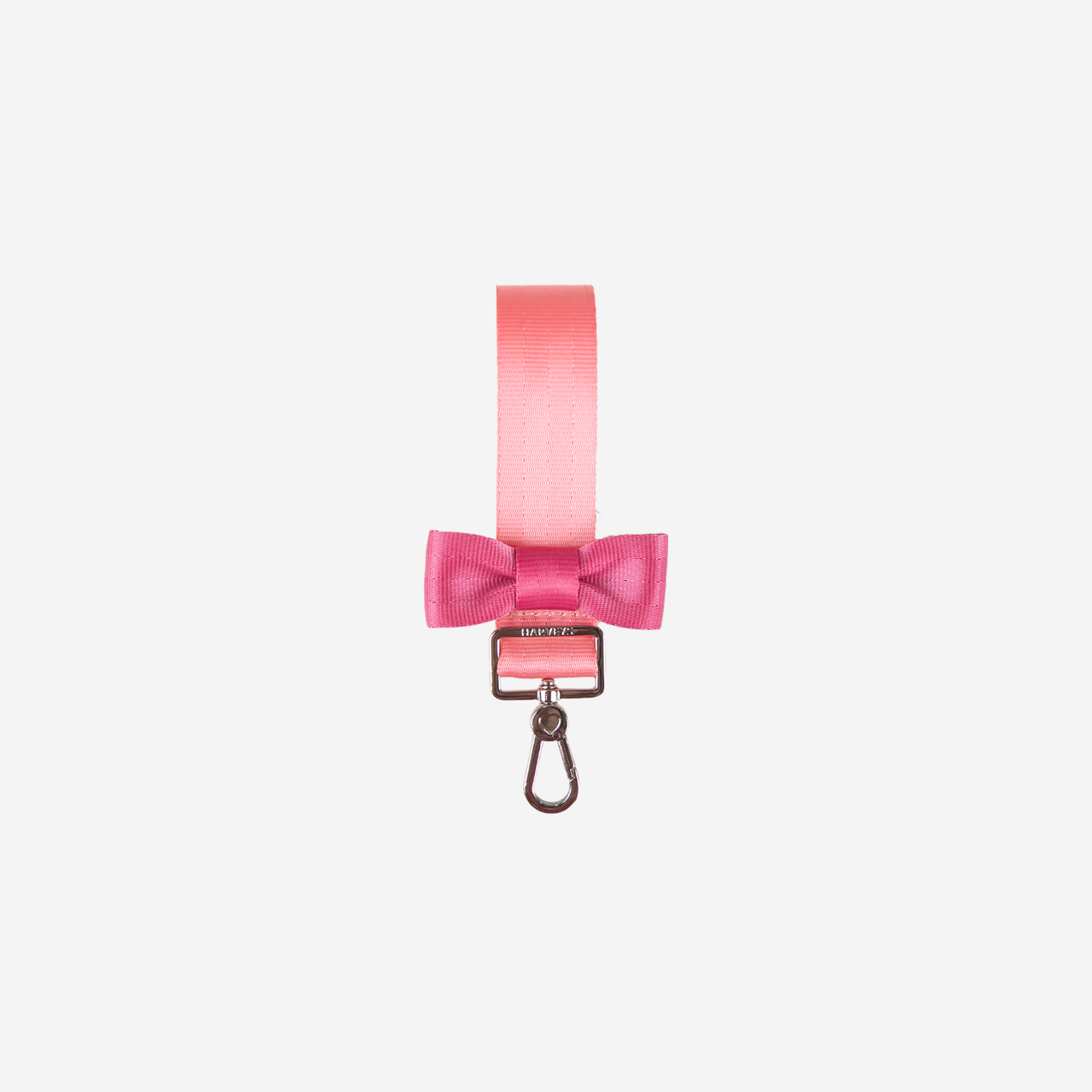View of a Bow Keychain in the colorway Cotton Candy + Fuchsia