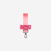 View of a Bow Keychain in the colorway Cotton Candy + Fuchsia