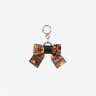 The front view of a Shag Tiki Tapa Bow Key Charm