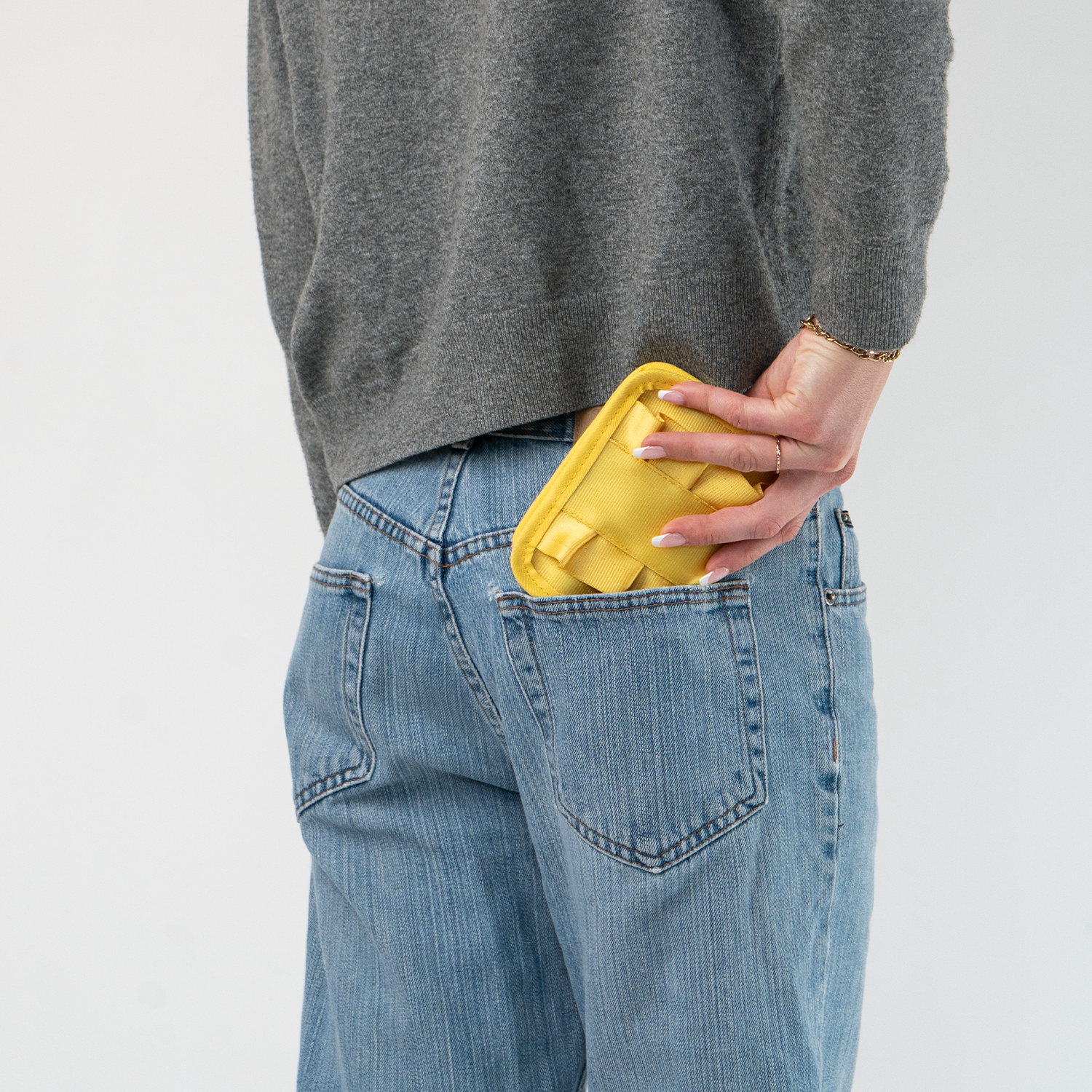 The Buttercup Lola Fun Size Wallet being held in a model's hand