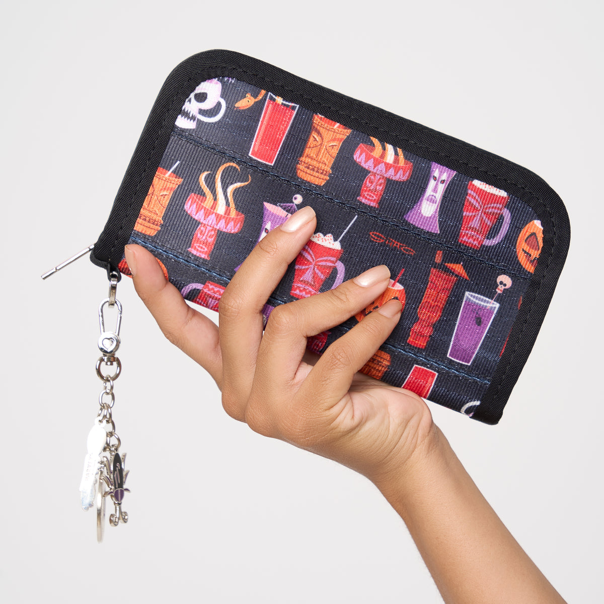 Model holding classic wallet Shag Spooky Tiki Cocktail