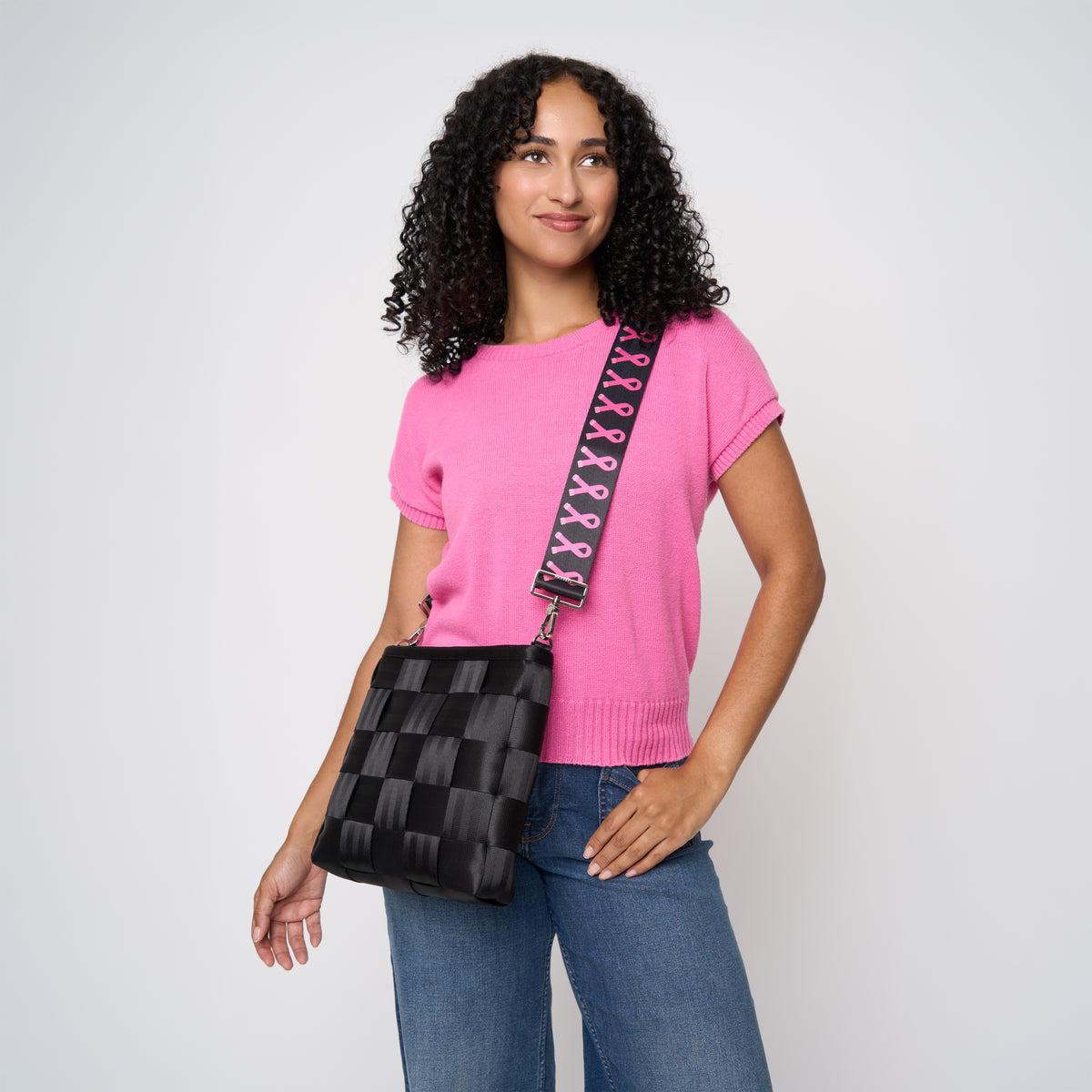 A model using The Pink Agenda Pink Ribbon 5 Panel Click N Carry