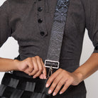 A model wearing a Black Widow 5 Panel Click N Carry with a bag