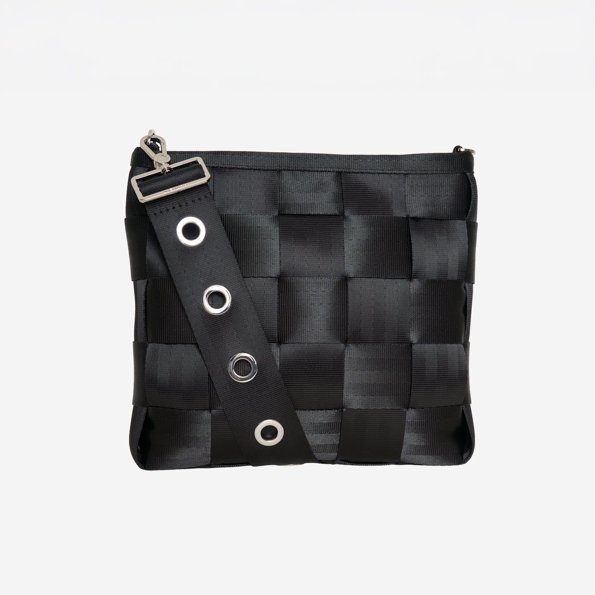 View of 5 panel Click n Carry in grommet attached to black mini messenger