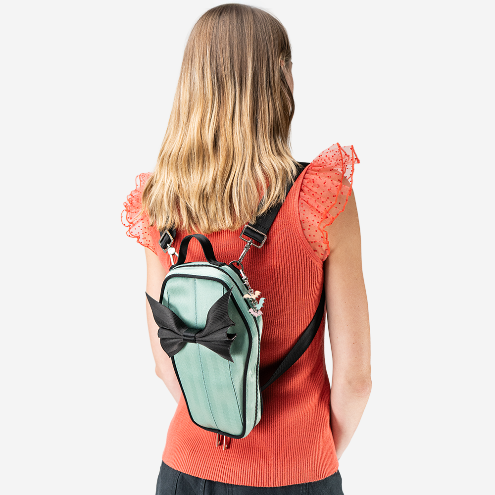 A Mint Coffin Convertible Crossbody being worn by a model.