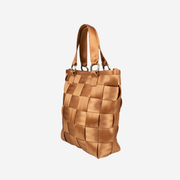 A side view of a Carriage Ring Bucket in the color Cognac
