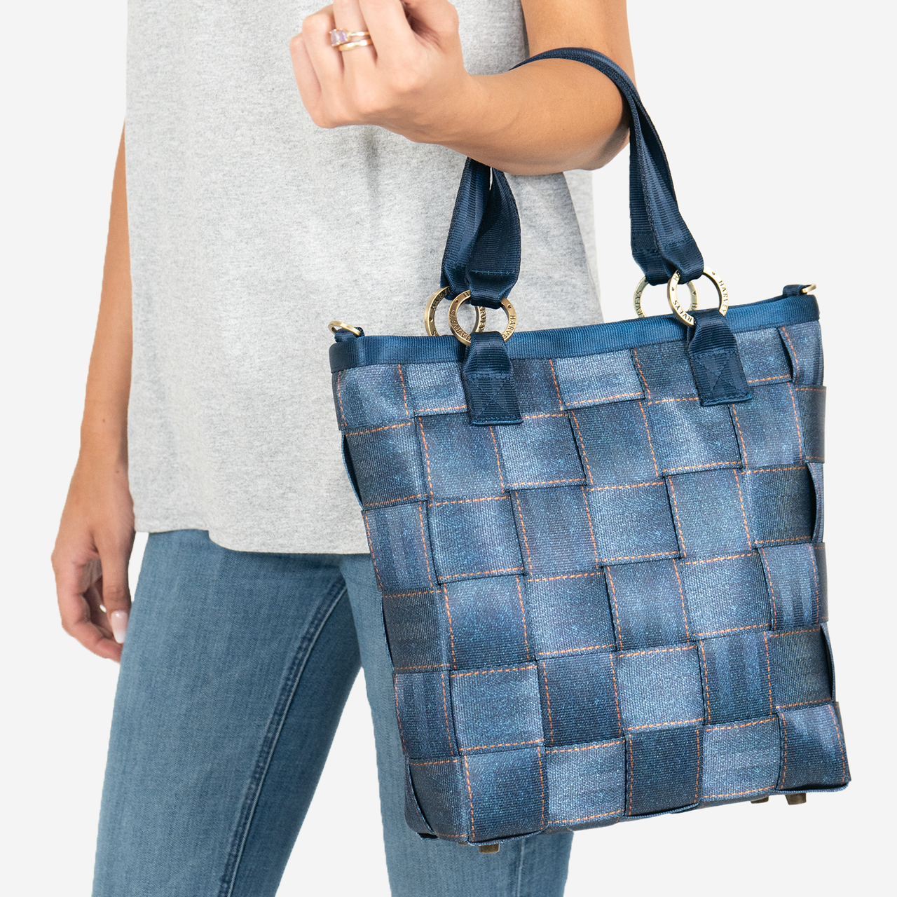 View of a Carriage Ring Bucket in Denim on a models arm