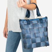 View of a Carriage Ring Bucket in Denim on a models arm
