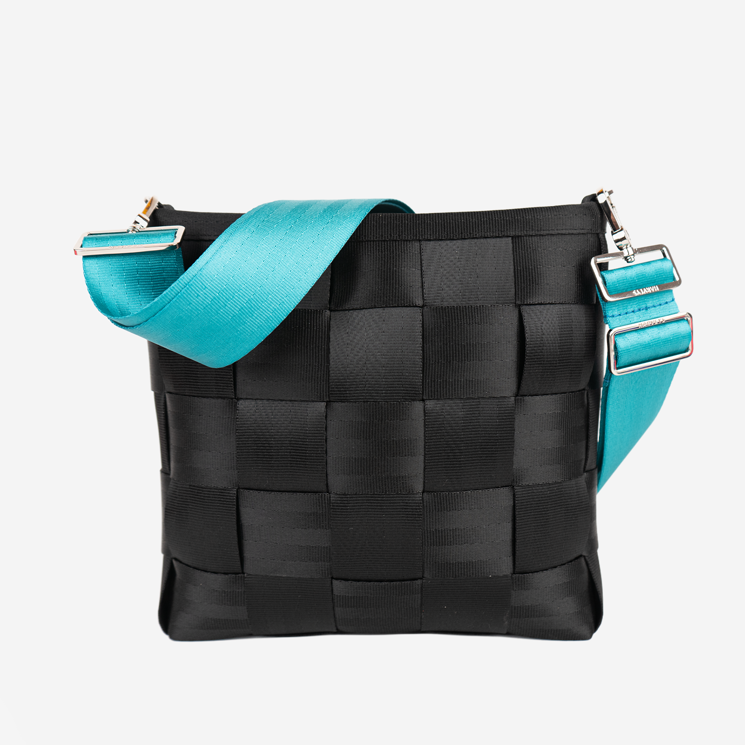 The 5 Panel Click N Carry in Aqua being used on a bag