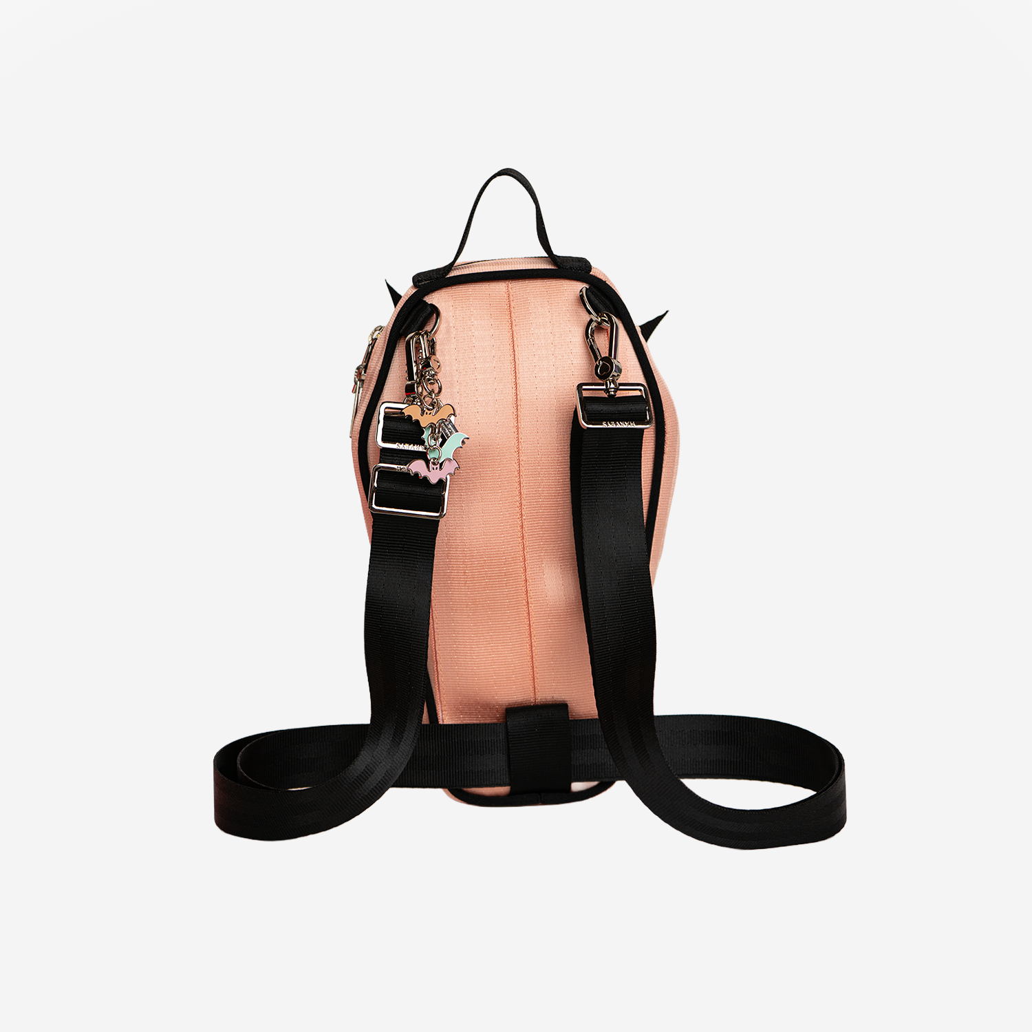 The back of a Coffin Convertible Crossbody in Cantaloupe