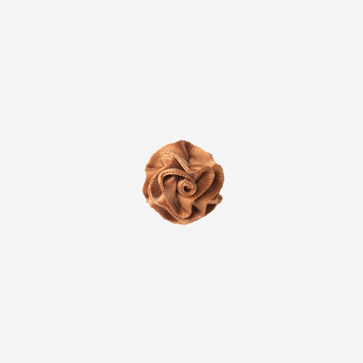 Front view of a Rosette Clip in the color Cognac