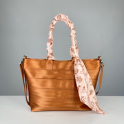 Cowgirl Scarf shown styles on a Cognac Medium Streamline Tote