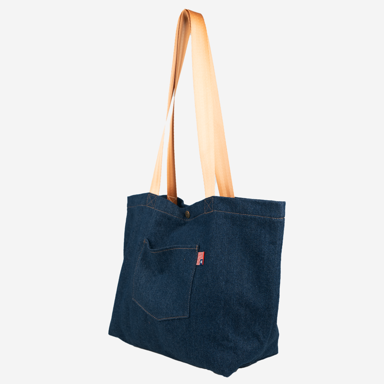 Side view of Denim Tote with Cognac handles
