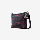 Front plus side view of black clutch with red Dracula and bat lettering and silver bat charm