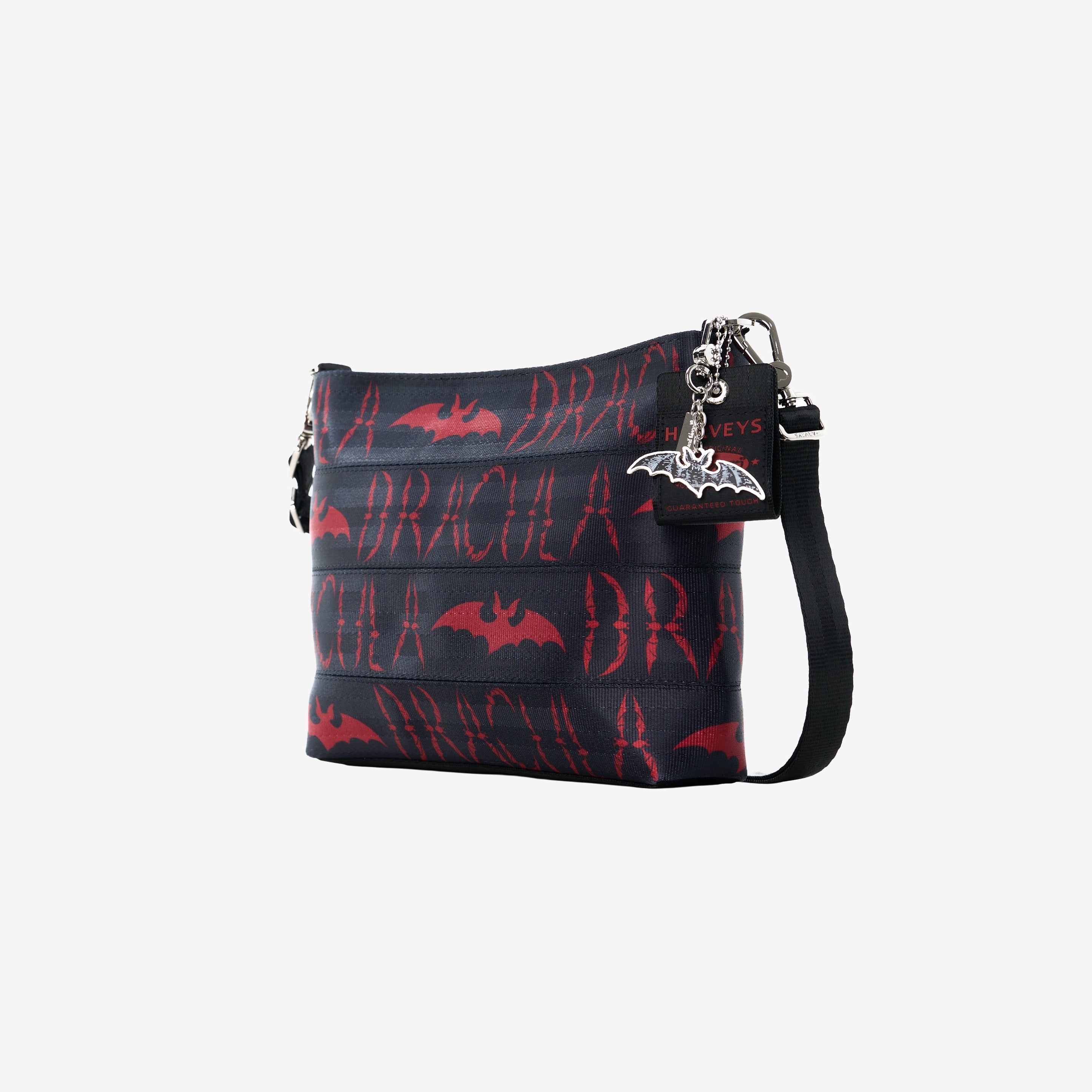 Front plus side view of black clutch with red Dracula and bat lettering and silver bat charm