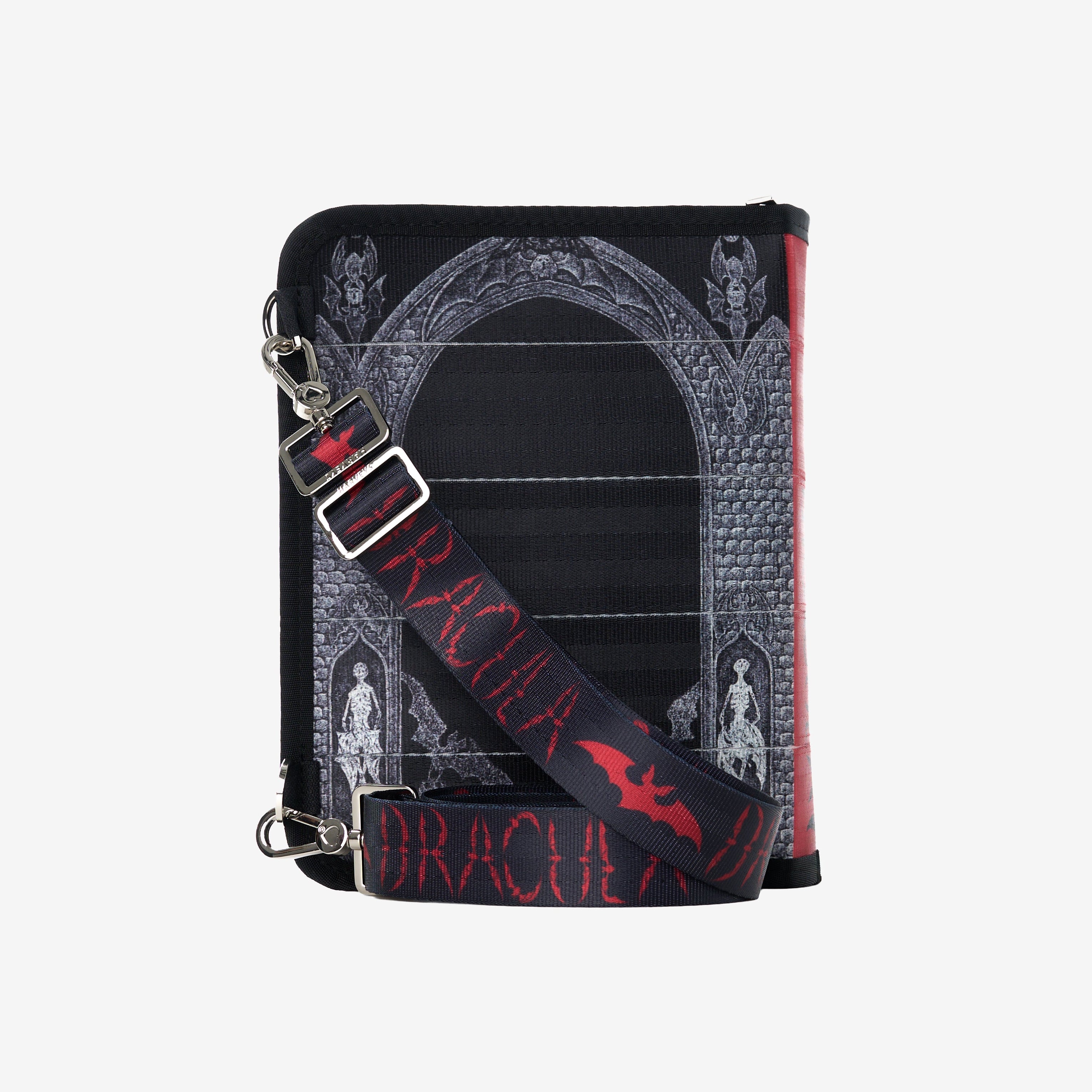 Back of black crossbody bag with detachable strap draped across 