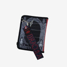 Back view of black crossbody bag with black Dracula strap draped across