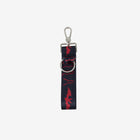 back view of key chain with Dracula and bat red print
