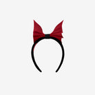 Front view of black headband with scarlet bat shaped bow