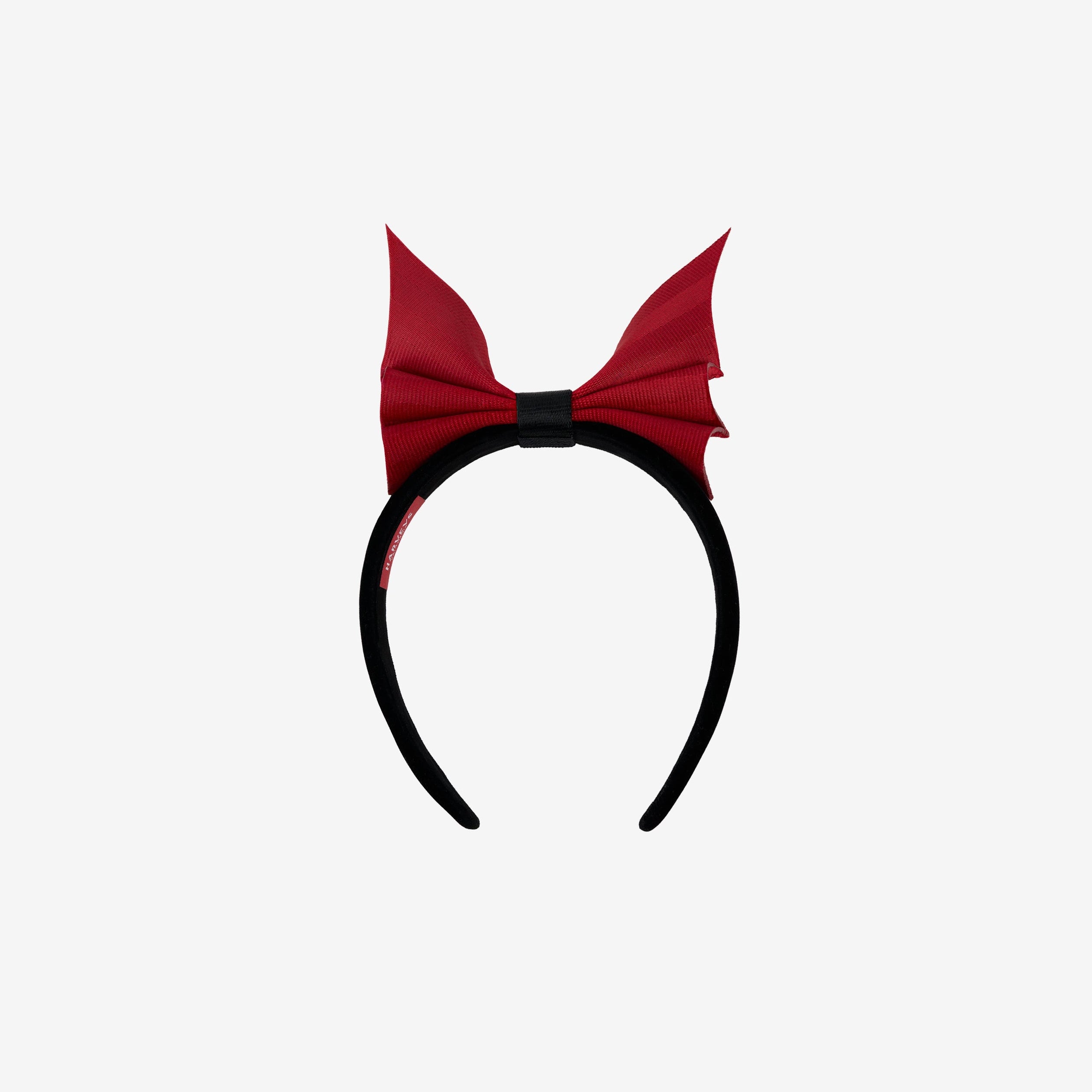 Front view of black headband with scarlet bat shaped bow
