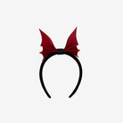 back view of black headband with scarlet bat shaped bow