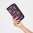 A model holding The Pink Agenda Pink Ribbon Full Wallet