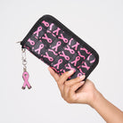 A model holding The Pink Agenda Pink Ribbon Full Wallet
