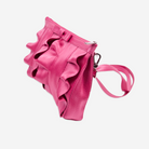 The side of a Fuchsia Lola Bow Clutch