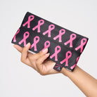 A model holding The Pink Agenda Pink Ribbon Glasses Case