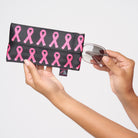 A model holding The Pink Agenda Pink Ribbon Glasses Case