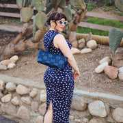 A Satchel in Indigo being worn by a Model