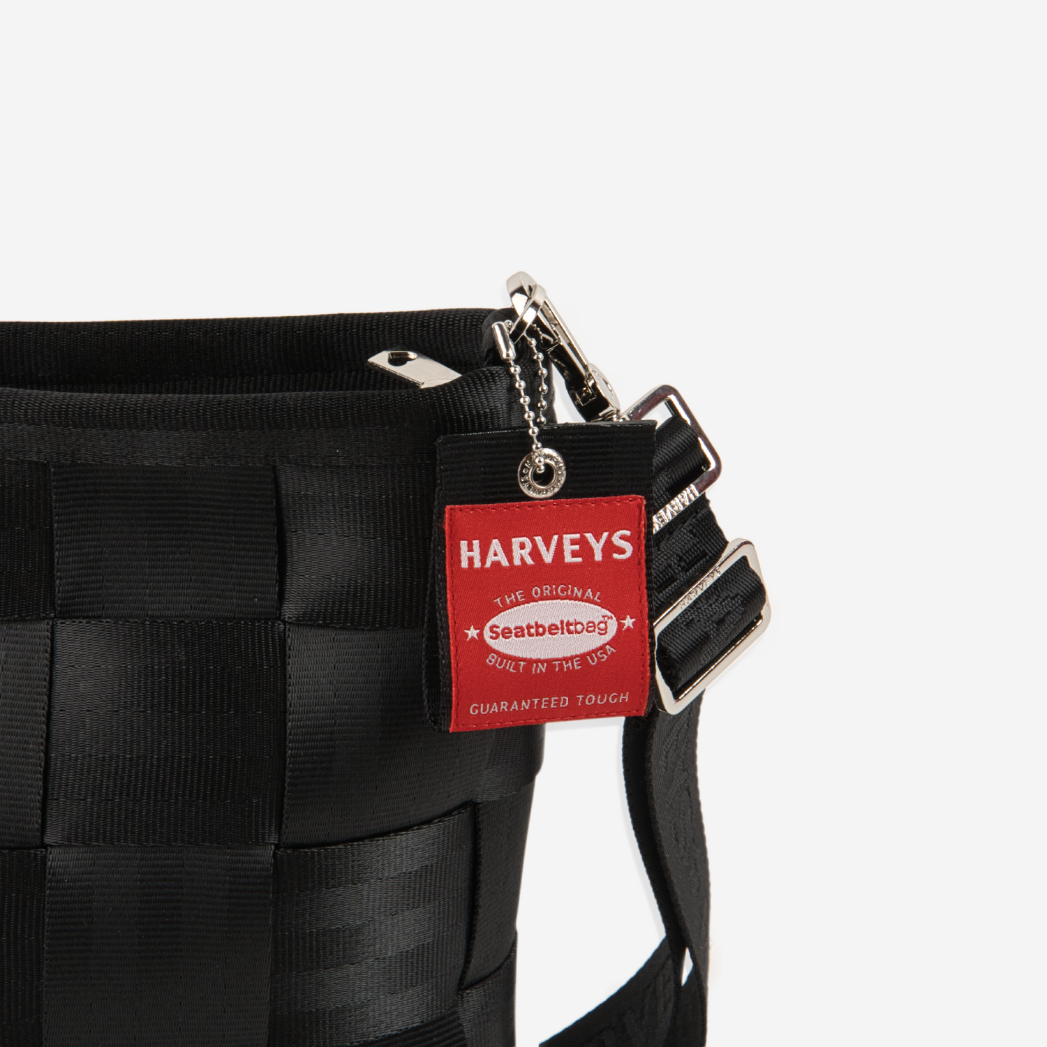 The Hangtag detail on a Mini Messenger in Black