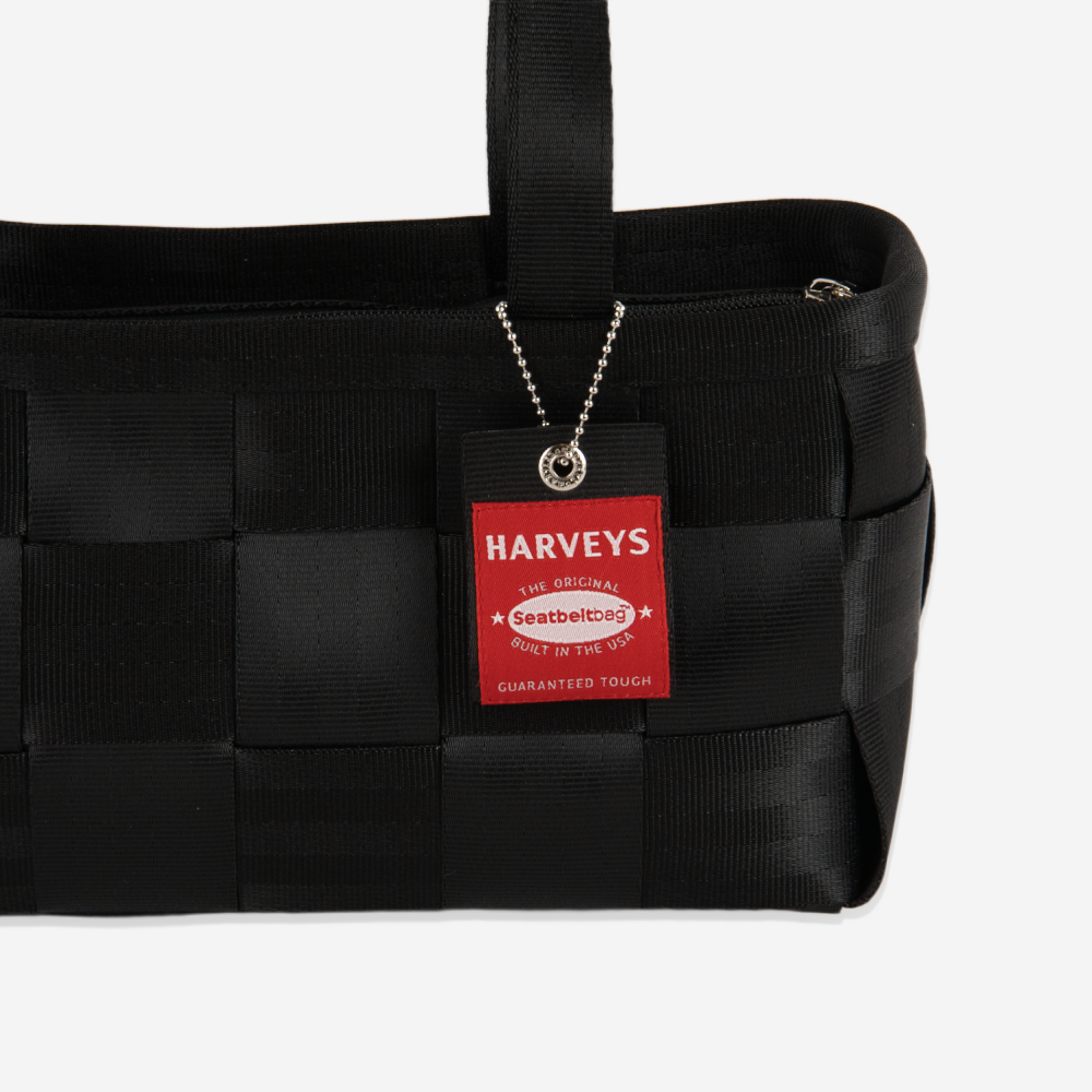 The Hangtag detail on a Satchel in Black