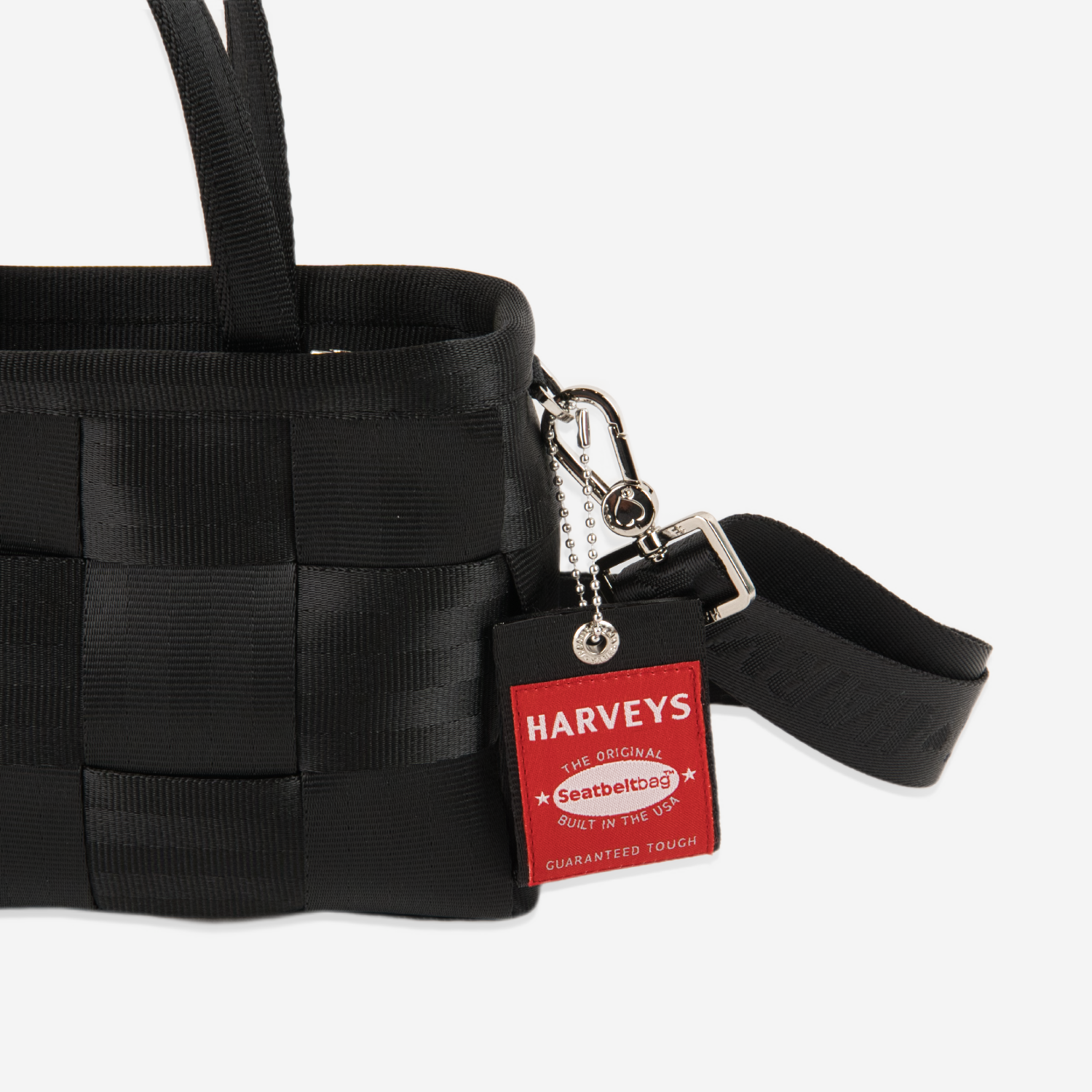The Hangtag detail on a Woven Petite Tote in Black