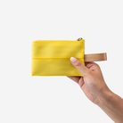 The Ice Pop Coin Purse in Lemon being held by a model