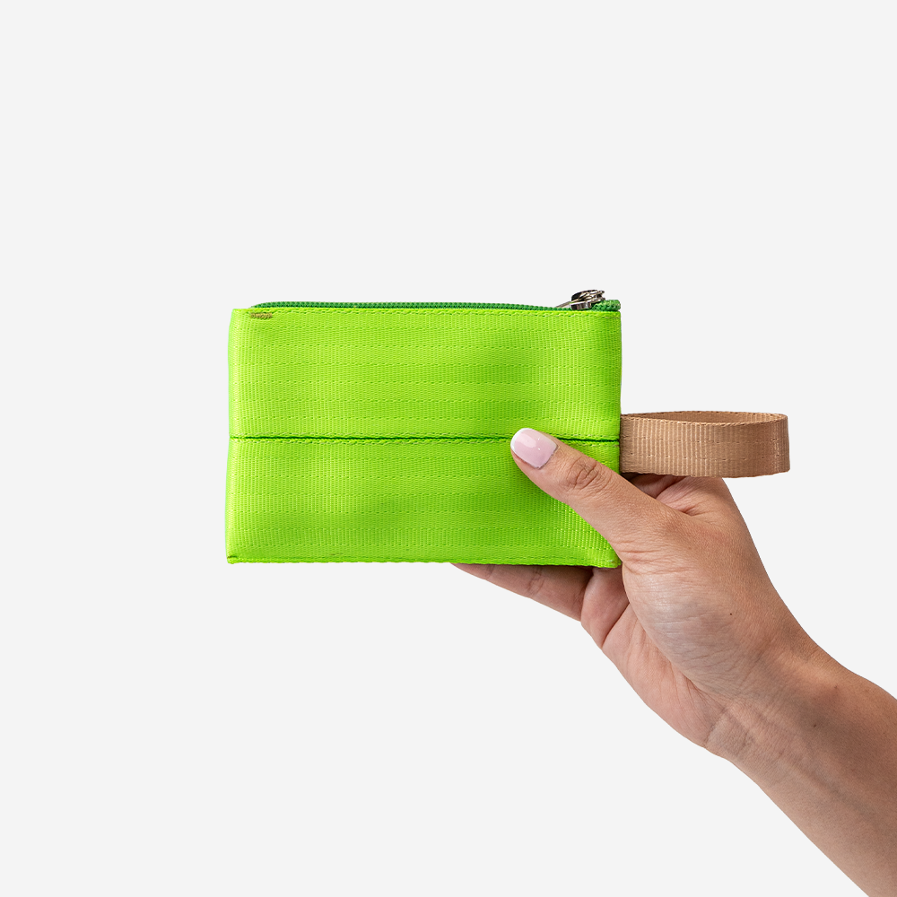 The Ice Pop Coin Purse in Lime being held by a model