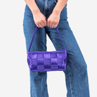 The Iris Baguette being held by a model
