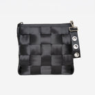 View of key chain in grommet attached to black mini messenger