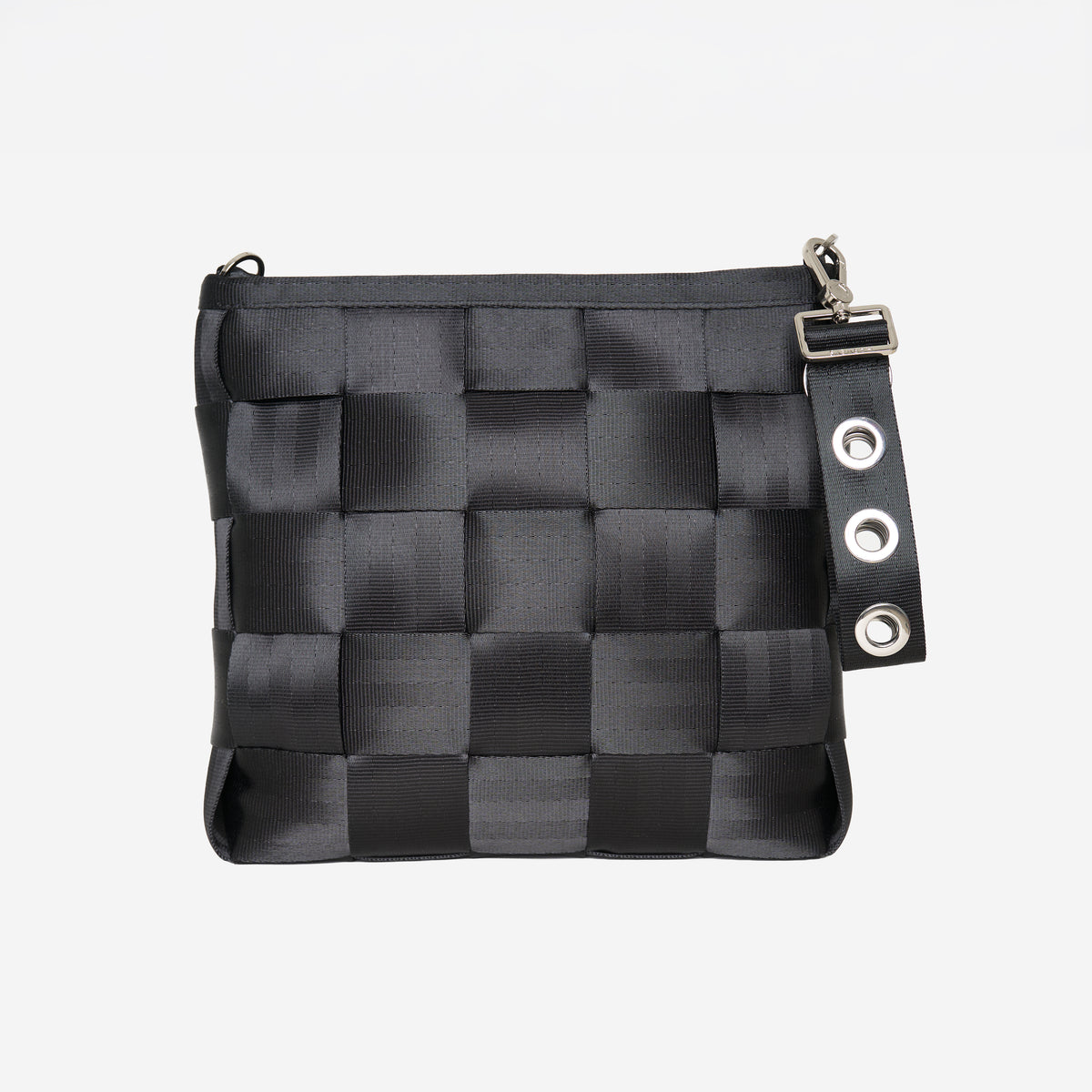 View of key chain in grommet attached to black mini messenger