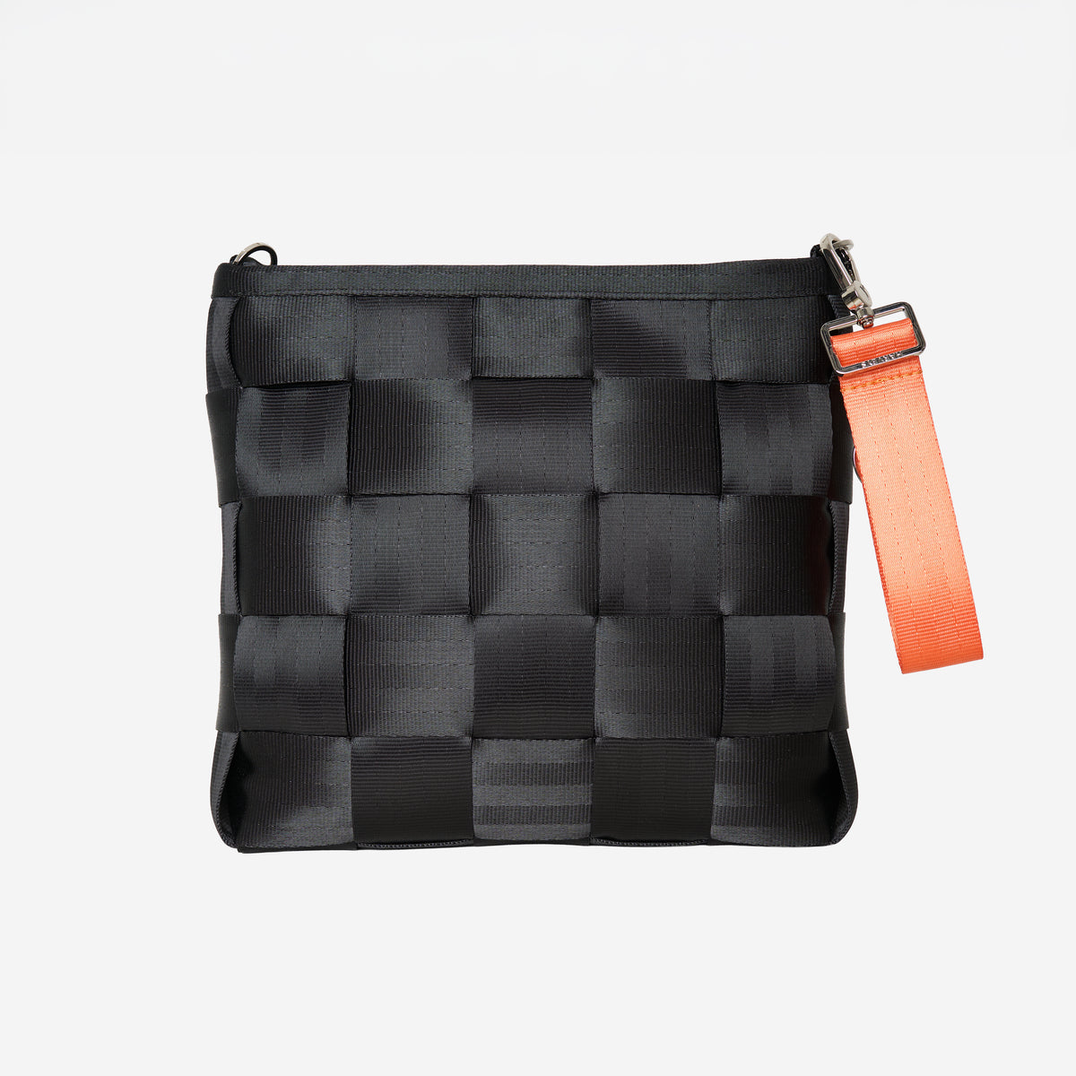 Front view of keychain orange attached to black mini messenger bag
