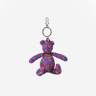 The front view of the Barbie And The Rockers Cali Bear Key Charm