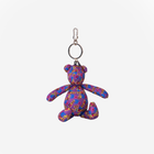 The front view of the Barbie And The Rockers Cali Bear Key Charm