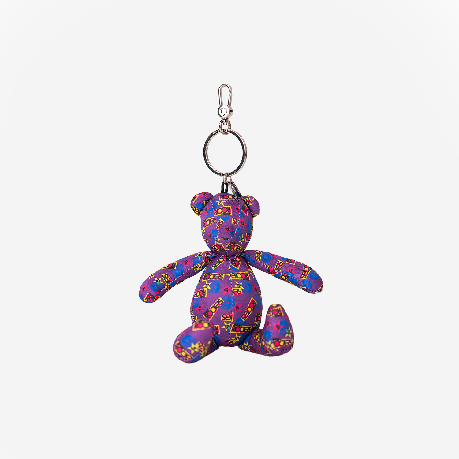 The front view of the Barbie And The Rockers Cali Bear Key Charm
