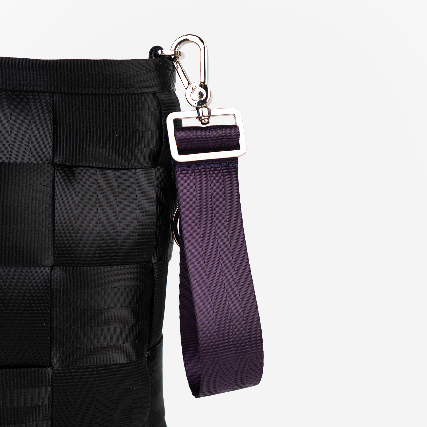 The 4 Panel Keychain in Blackberry being used on a bag