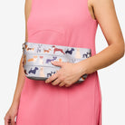 MAKEUP CASE TOP DOG ON MODEL AS CLUTCH
