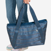 View of a Large Boat Tote in Denim being held by a models hand