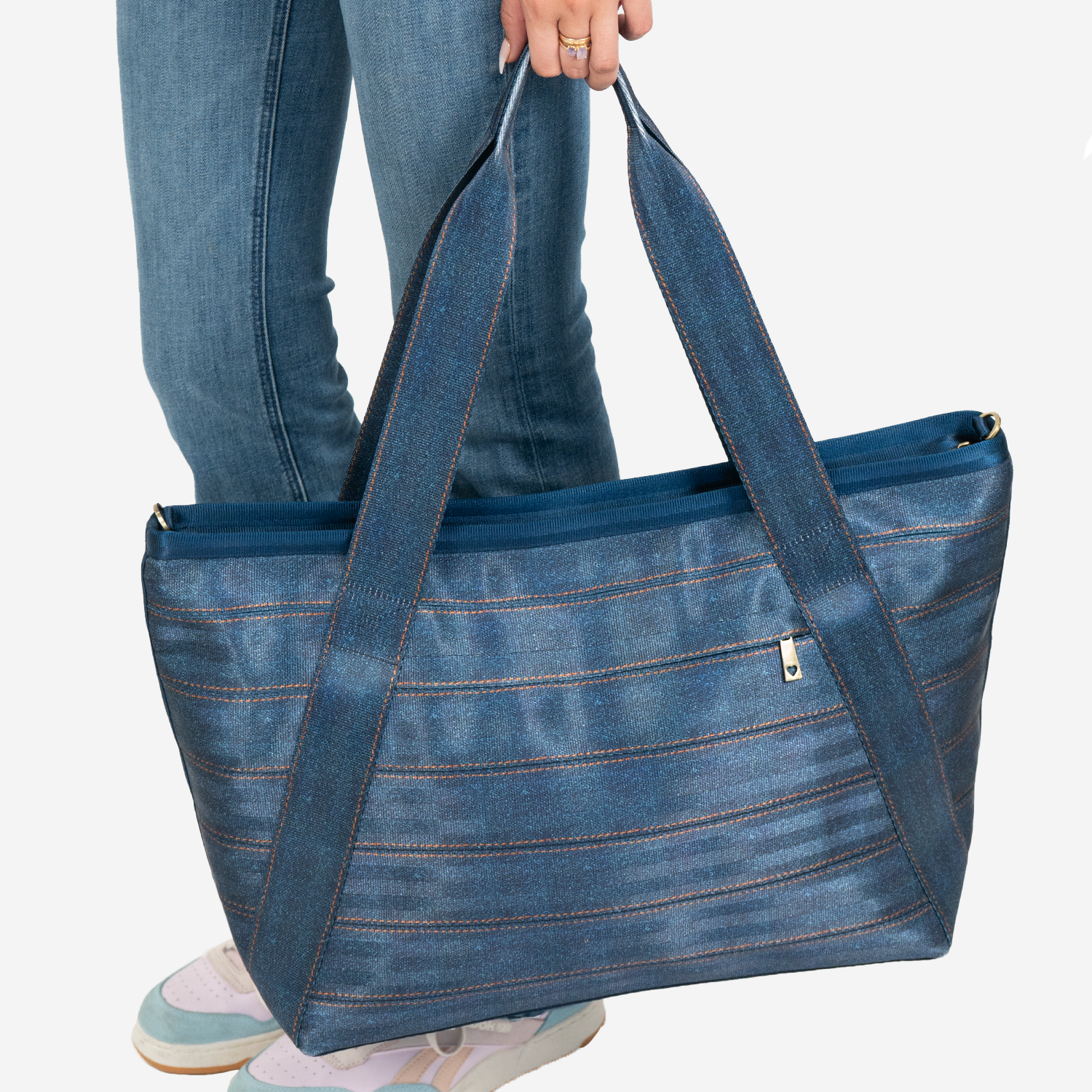 View of a Large Boat Tote in Denim being held by a models hand